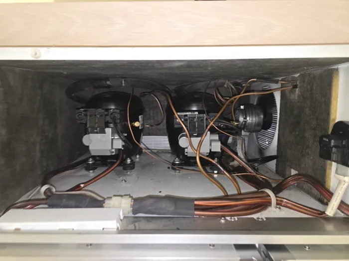 Dual compressor bay inside a refrigeration unit